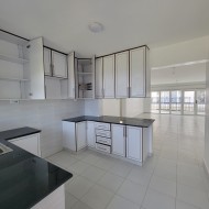 Kitchen with white cabinets and white wall